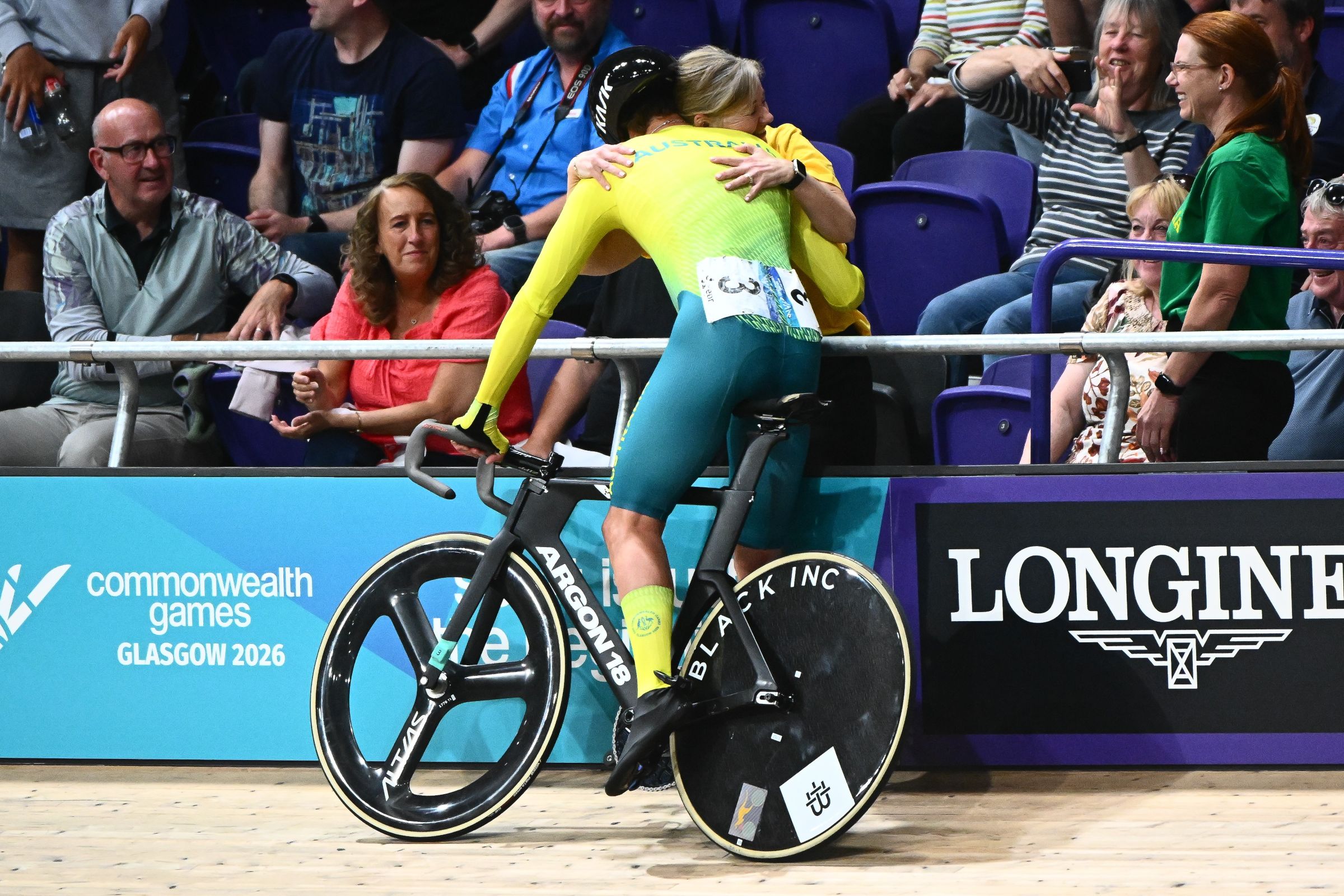 Australian cyclist Blake Agnoletto hugs his mother in the stands as he celebrates winning the elimination race at the 2026 Glasgow Commonwealth Games
